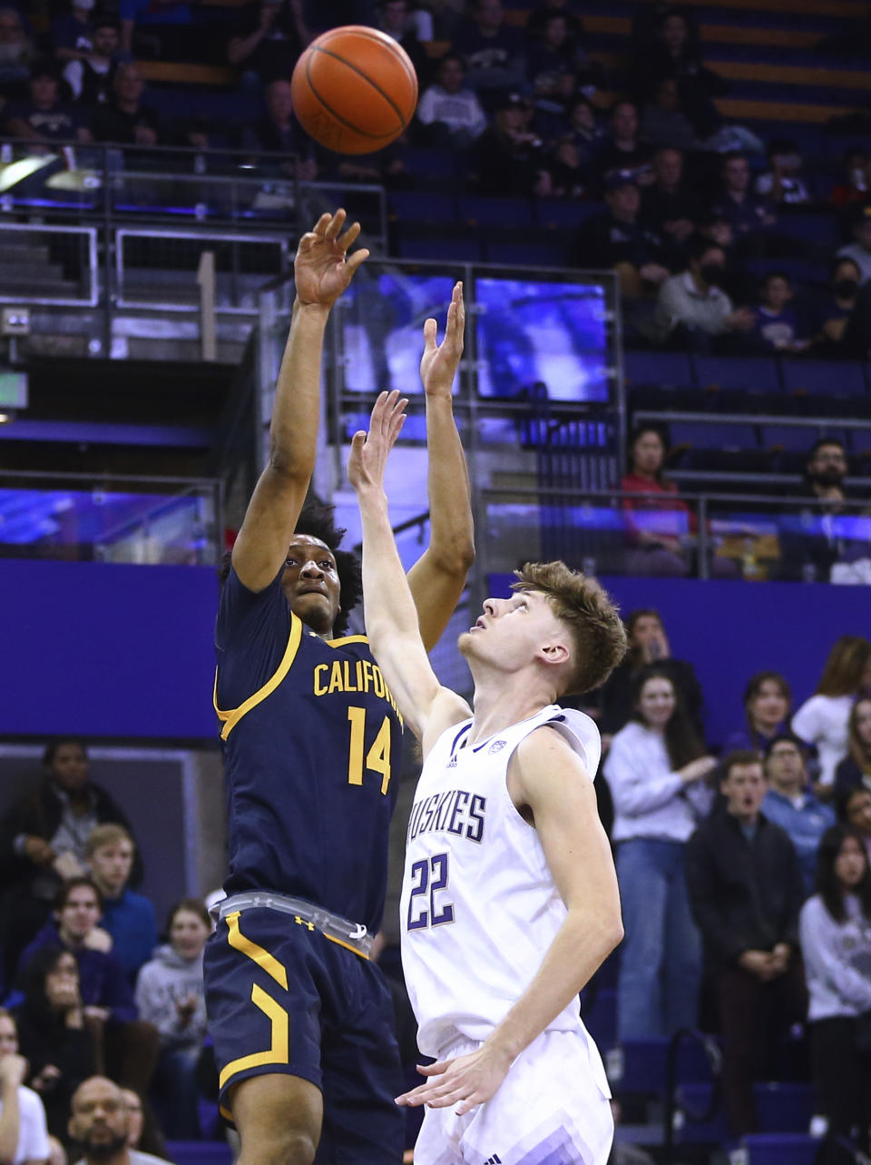 California forward Grant Newell (14) shoots over Washington guard Cole Bajema (22) during the first half of an NCAA college basketball game Saturday, Jan. 14, 2023, in Seattle. (AP Photo/Lindsey Wasson)