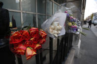 Flower tributes to late nurse Jacintha Saldanha are seen outside the residential apartments of the the King Edward VII hospital where she was found dead, in central London, Monday, Dec. 10, 2012. Australian radio hosts managed to impersonate Queen Elizabeth II and Prince Charles and received confidential information about the Duchess of Cambridge's medical condition, in a hoax phone call to the hospital where the pregnant Duchess was staying and which was broadcast on-air. The controversial prank took a dark twist three days later with the death of nurse Saldanha, a 46-year-old mother of two, who was duped by the DJs despite their Australian accents. (AP Photo/Lefteris Pitarakis)