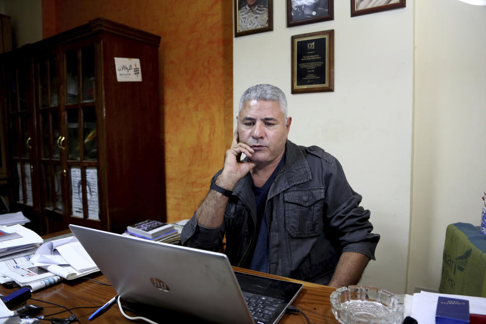 In this Nov. 21, 2018 photo, Gamal Eid, a prominent rights lawyer and advocate listens during an interview with The Associated Press at his office, in Cairo, Egypt. (AP Photo/Ahmed Hatem)