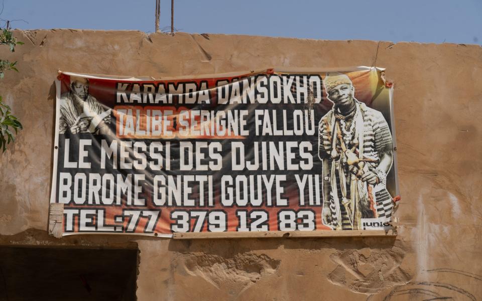 An advertisement outside Karamba's clinic carries his tag: 'The Messi of Djinns' - Sam Bradpiece