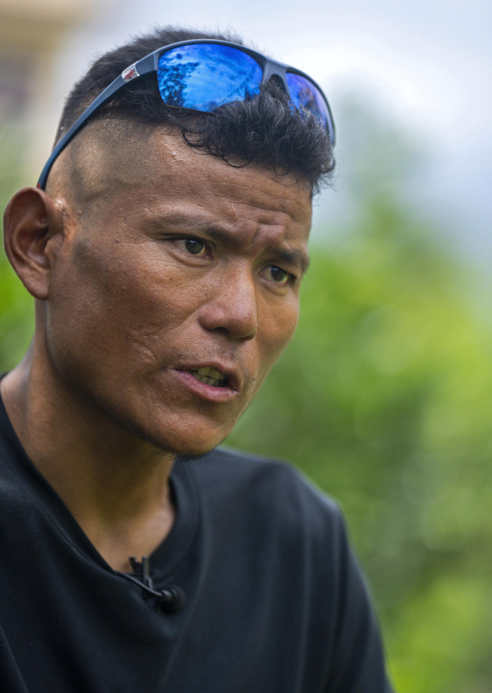 Nepal's sherpa guide Tenjen Sherpa, 35, who with Norwegian climber Kristin Harila climbed the world's 14 tallest mountains in record time, speaks during an interview with The Associated Press in Kathmandu, Nepal, Wednesday, Aug. 9, 2023. Sherpa and Harila shattered the record for the fastest climb of the 14 mountains more than 8,000 meters (about 26,000 feet) high when they topped Mount K2 in Pakistan late last month. The previous record was 189 days, and the pair did it in 92 days. (AP Photo/Niranjan Shrestha)