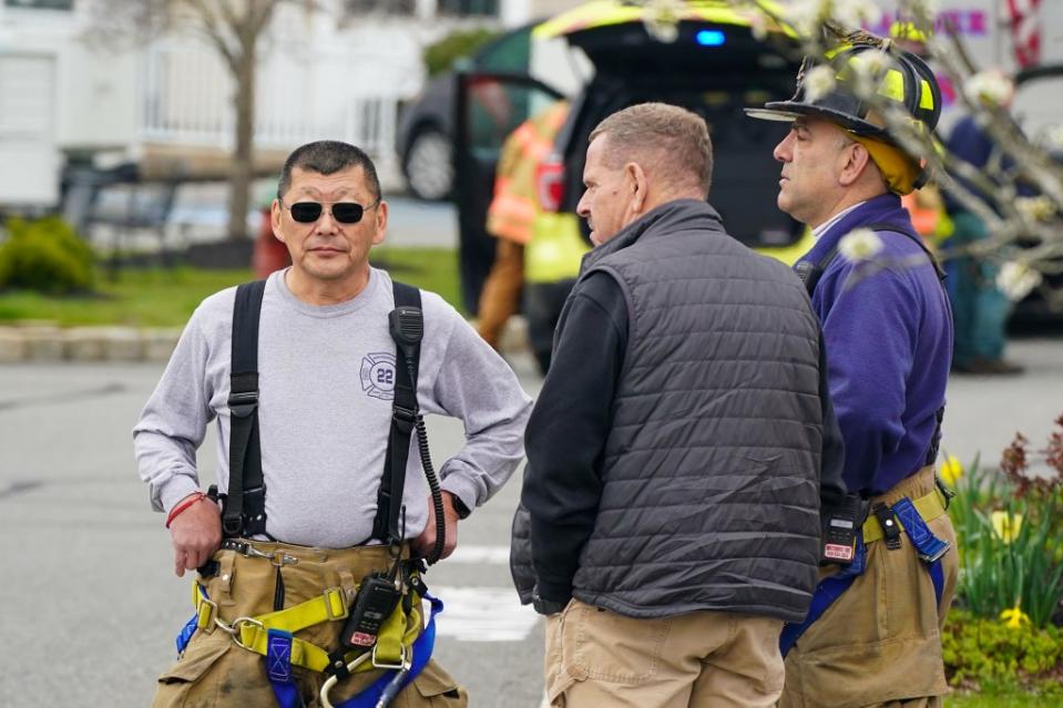 Lebanon firemen check on housing after the quake on Friday. Robert Miller