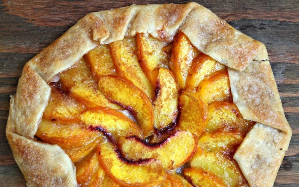 <p>Parade</p><p>This simple, impressive dessert starts with a store-bought pie crust. Add a little sugar, cinnamon and butter and bake until lightly browned. Slice it into wedges and serve with a small scoop of <a href="https://parade.com/846549/sarahhardy/15-sugar-free-ice-cream-recipes/" rel="nofollow noopener" target="_blank" data-ylk="slk:vanilla ice cream;elm:context_link;itc:0;sec:content-canvas" class="link ">vanilla ice cream</a> for maximum enjoyment.</p><p><strong>Get the recipe: </strong><strong><a href="https://parade.com/65435/lorilange/easy-peach-galette/" rel="nofollow noopener" target="_blank" data-ylk="slk:Peach Galette;elm:context_link;itc:0;sec:content-canvas" class="link ">Peach Galette</a></strong></p>