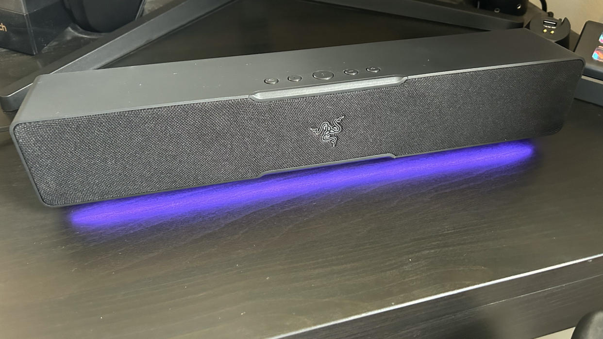  Razer Leviathan V2 X soundbar on a desk with RGB lighting switched on 