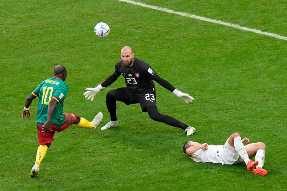 Cameroon’s Vincent Aboubakar, left, scores the second goal past Serbia’s goalkeeper Vanja Milinkovic-Savic during the World Cup group G soccer match between Cameroon and Serbia, at the Al Janoub Stadium in Al Wakrah, Qatar (AP)