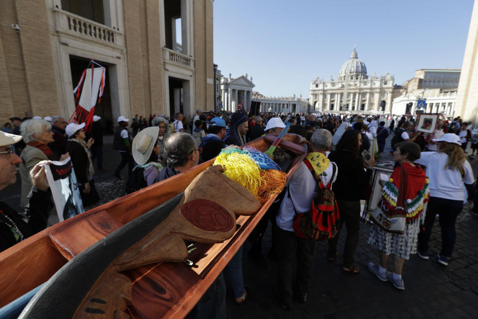 Members of Amazon indigenous populations walk during a Via Crucis (Way of the Cross) procession from St. Angelo Castle to the Vatican, Saturday, Oct. 19, 2019. Pope Francis is holding a three-week meeting on preserving the rainforest and ministering to its native people as he fended off attacks from conservatives who are opposed to his ecological agenda. (AP Photo/Andrew Medichini)