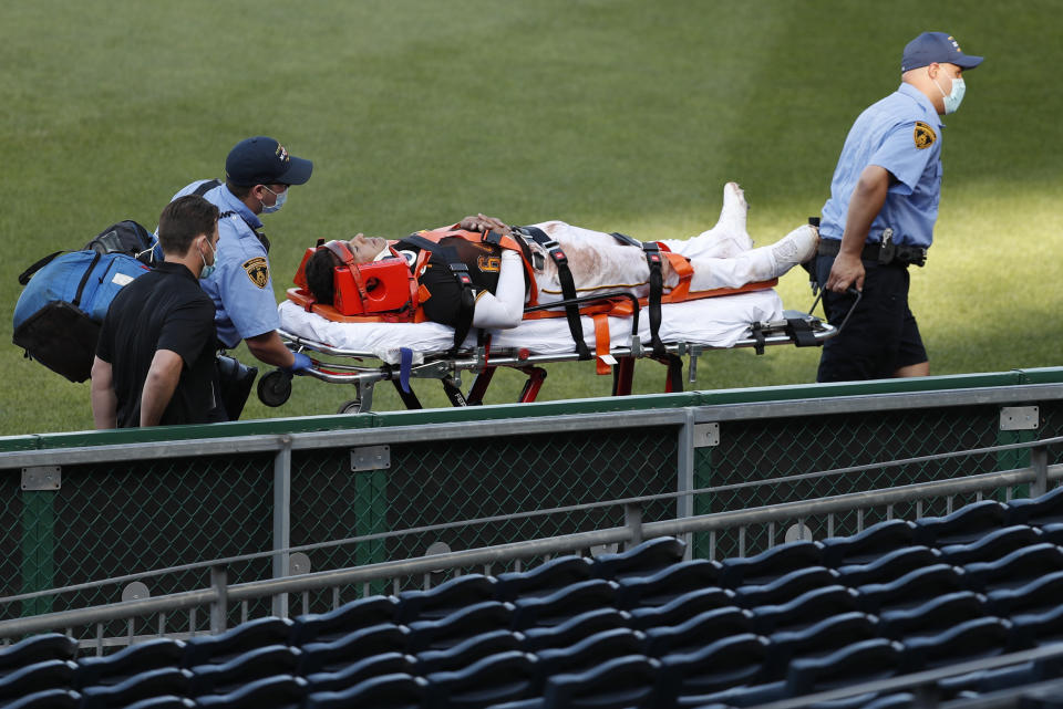 Pittsburgh Pirates' Phillip Evans is taken from the field on a stretcher after he collided with Gregory Polanco along the right field fence while chasing a fly ball hit by Detroit Tigers' Miguel Cabrera during the sixth inning of a baseball game Saturday, Aug. 8, 2020, in Pittsburgh. Polanco stayed in the game. (AP Photo/Keith Srakocic)