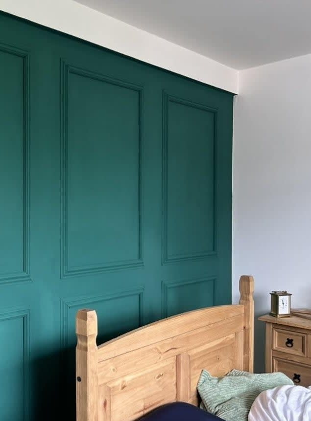 bright teal blue wall in a bedroom
