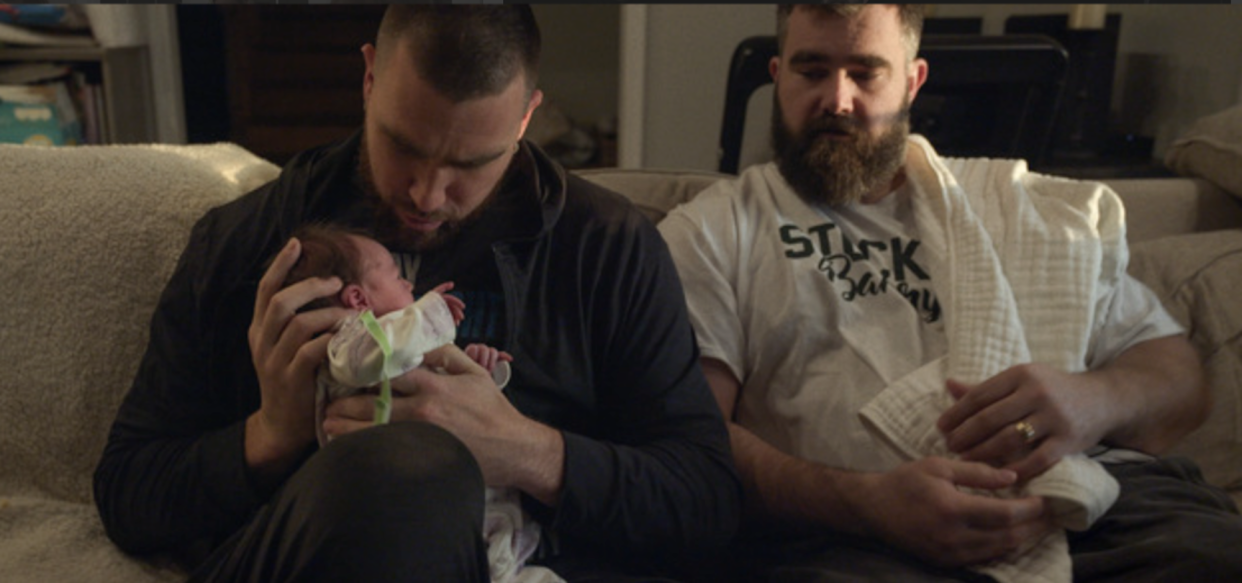 Travis (left) and Jason Kelce practice their parenting skills in Kelce. (Prime Video) 
