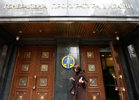 A woman leaves Ukraine's Prosecutor General's Office in Kiev