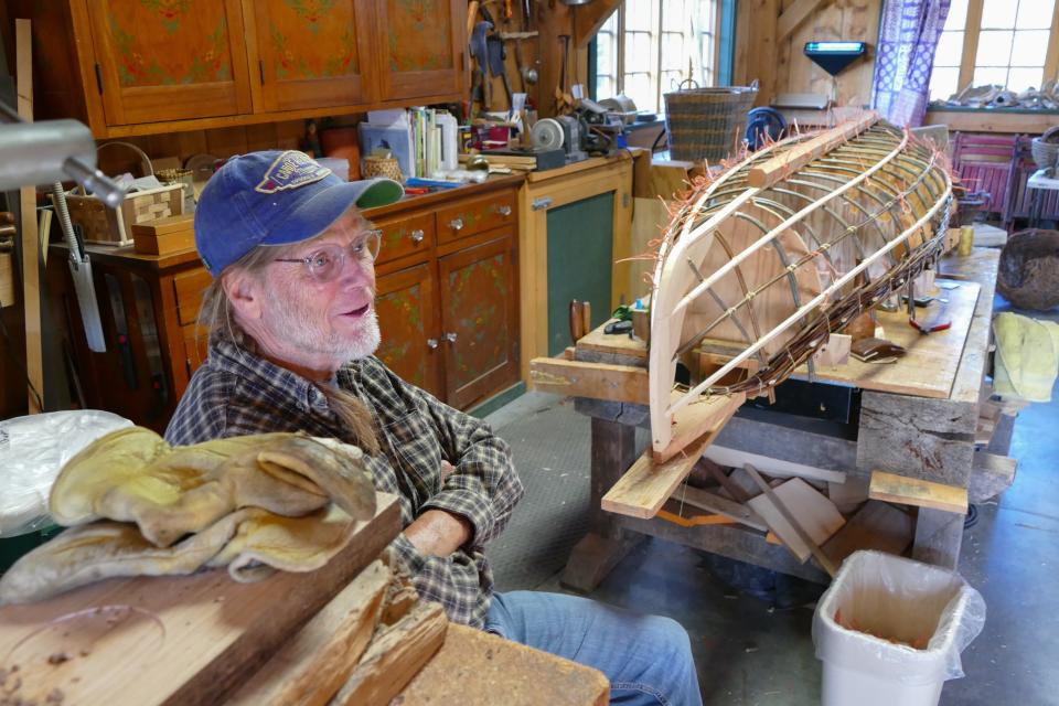 Lindsay Lee explains his experimental process for incorporating homegrown willow into the gunnel of a canoe he’s building.
