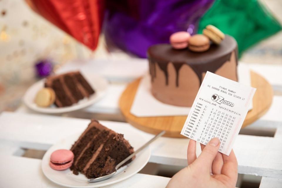 Oz Lotto winner celebrates by eating cake