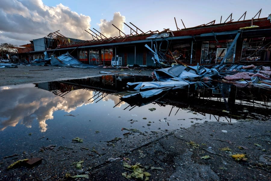 <em>The roof of a local businesses is strewn about after a tornado passed through Selma, Ala., Thursday, Jan. 12, 2023. (AP Photo/Butch Dill)</em>