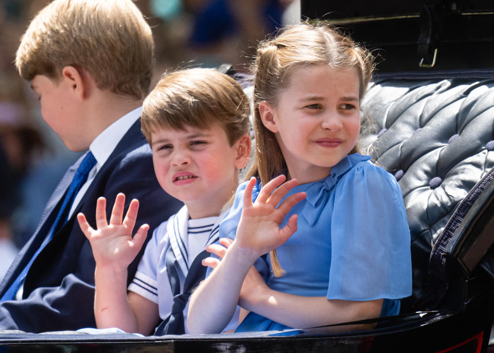 Prince George, Princess Charlotte, and Prince Louis ride in the carriage procession at Trooping the Colour