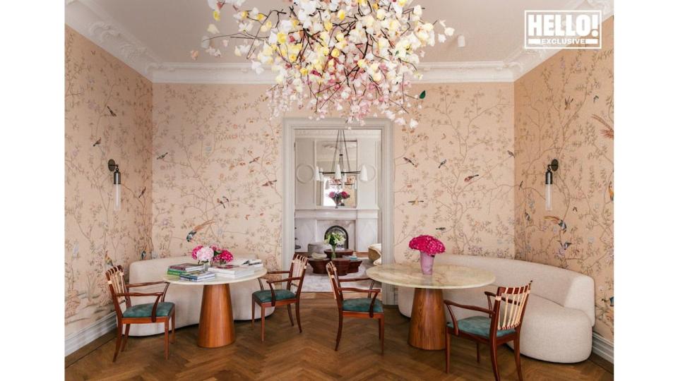 Camilla Austad Knutsen's floral dining room with tables and chairs at Oslo home