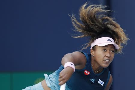 Mar 22, 2019; Miami Gardens, FL, USA; Naomi Osaka of Japan serves against Yanina Wickmayer of Belgium (not pictured) in the second round of the Miami Open at Miami Open Tennis Complex. Mandatory Credit: Geoff Burke-USA TODAY Sports