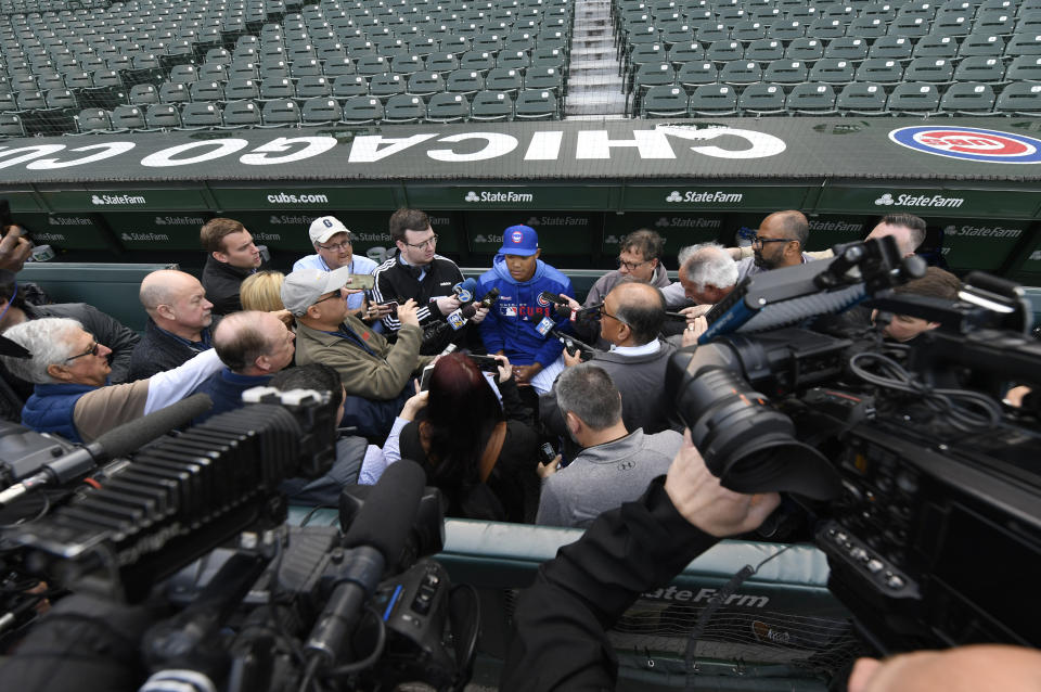 Chicago Cubs shortstop Addison Russell speaks to the media in the dugout before a baseball game against the Miami Marlins. Russell rejoins the team after completing a 40-game suspension for violating Major League Baseball's domestic violence policy and spending extra time in the minors to get ready. (AP)