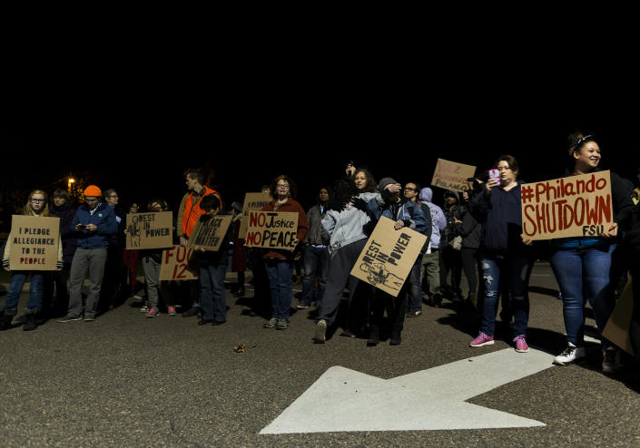 <p>People gather at JJ Hill Montessori school, where Philando Castile worked, on November 16, 2016 in St. Paul, Minn. Ramsey County Attorney John Choi filed charges today against St. Anthony Police Officer Jeronimo Yanez who shot and killed Castile during a traffic stop this past July. (Stephen Maturen/Getty Images) </p>