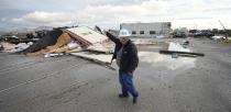 Johnny Graham surveys storm damage Tuesday, Jan. 24, 2023, in Pasadena, Texas. A powerful storm system took aim at Gulf Coast Tuesday, spawning tornados that caused damage east of Houston. (AP Photo/David J. Phillip)