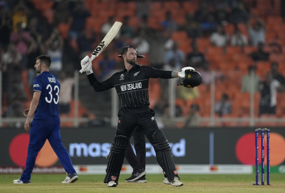 New Zealand's Devon Conway celebrates his century during the ICC Cricket World Cup opening match between England and New Zealand in Ahmedabad, India, Thursday, Oct. 5, 2023. (AP Photo/Ajit Solanki)