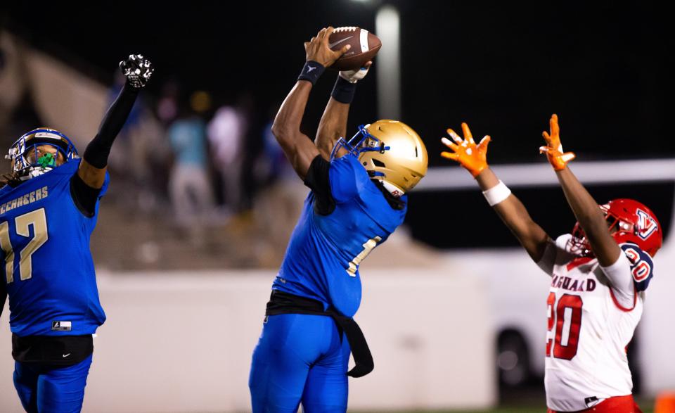 Mainland Buccaneers Zavier Mincey (1) hauls in an interception. The Mainland Buccaneers hosted the Vanguard Knights at Daytona Stadium in Daytona Beach, FL on Friday, December 1, 2023 in the 2023 FHSAA Football State Championships. Vanguard lost 34-12. [Doug Engle/Ocala Star Banner]