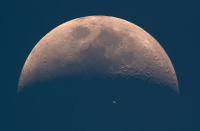 <p>The International Space Station (ISS) whizzes across the dusky face of the Earth’s natural satellite, the Moon, whilst photographed in broad daylight. (Pic: Dani Caxete) </p>