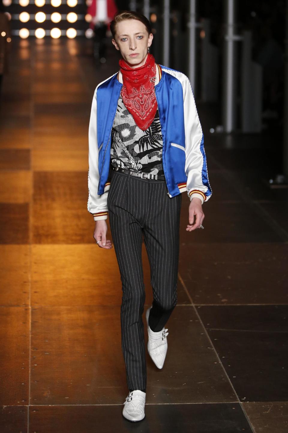 A model presents a creation as part of Yves Saint Laurent's men's fashion Spring-Summer 2014 collection, presented Sunday, June 30, 2013 in Paris. (AP Photo/Francois Mori)