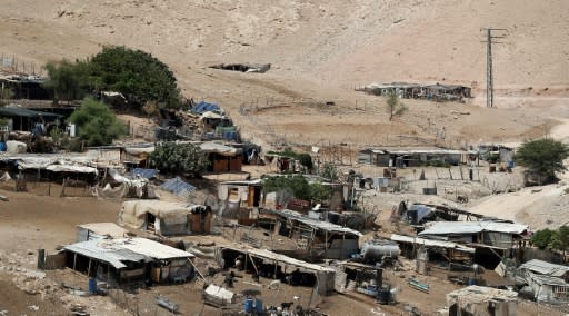 Residents of the Palestinian Bedouin village of Khan al-Ahmar in the occupied West Bank fear Israeli troops are poised to demolish it after they removed caravans pitched by activists on the outskirts following the expiry of a court stay