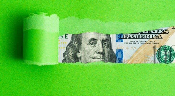 Currency behind green paper