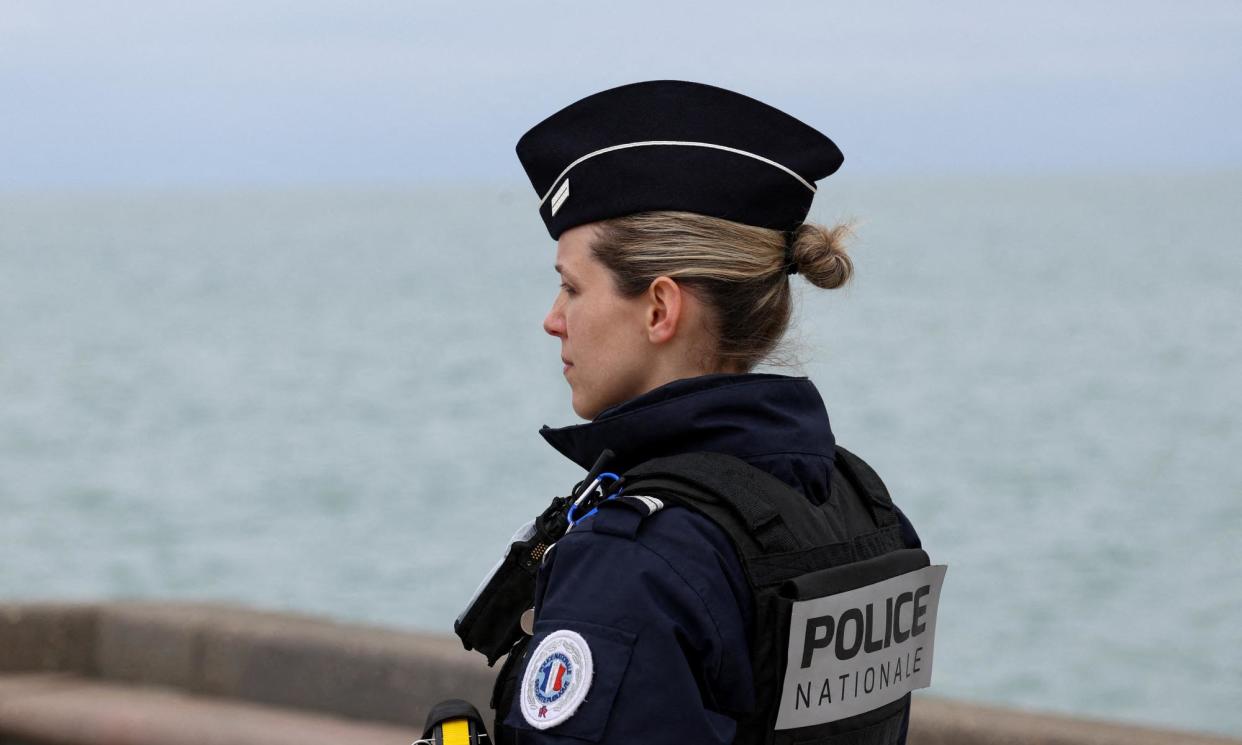 <span>A French police officer looks out to sea in Wimereux, where a child and four adults drowned attempting to cross the Channel on Tuesday.</span><span>Photograph: Yves Herman/Reuters</span>