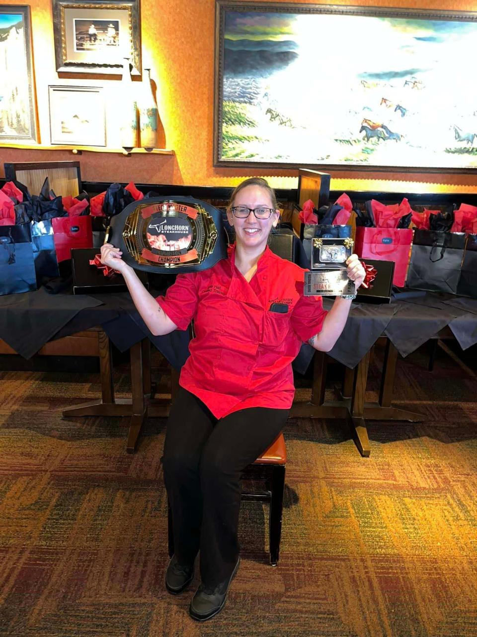Kylie Hall shows off her LongHorn Steakhouse’s Steak Master Champion Regional prizes March 7, 2023.