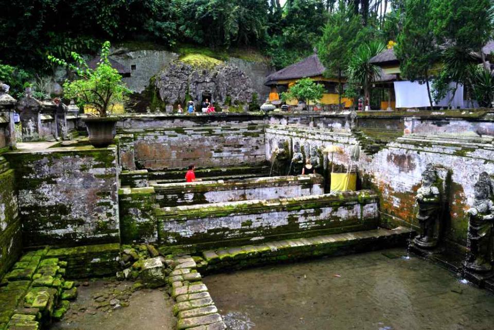 <b>The stepwell at the Goa Gajah Temple in Bali, Indonesia</b> <br><br> Carved images of the Buddha and smaller shrines and a step-well dot the green landscape of this 11th century site, called Lwa Gajah, which was not discovered until the 1950s. This Hindu temple was believed to be the sanctuary of a Buddhist monk.