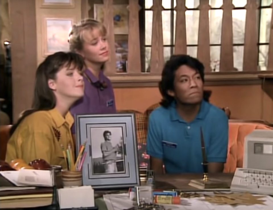 3 women sitting at a desk