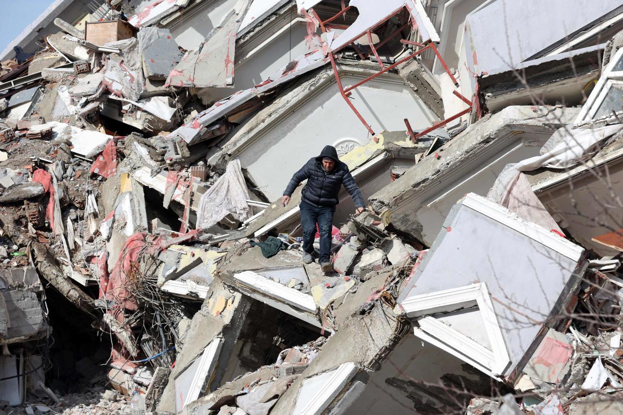 A man walks down the rubble of a collapsed building in Kahramanmaras, Turkey (AFP/Getty)
