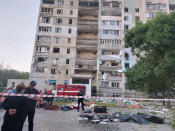 In this photo provided by the Ukrainian Emergency Service, a damaged residential building is seen in Odesa, Ukraine, early Friday, July 1, 2022, following Russian missile attacks. Ukrainian authorities said Russian missile attacks on residential buildings in the port city of Odesa have killed more than a dozen people. (Ukrainian Emergency Service via AP)