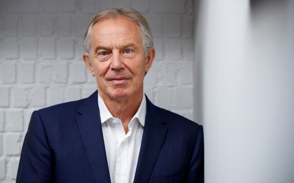 Tony Blair poses for a photograph ahead of an interview - TOLGA AKMEN/AFP