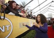 Actress Oprah Winfrey, from the film "The Butler," arrives at the 20th annual Screen Actors Guild Awards in Los Angeles, California January 18, 2014. REUTERS/Mario Anzuoni (UNITED STATES - Tags: ENTERTAINMENT) (SAGAWARDS-ARRIVALS)