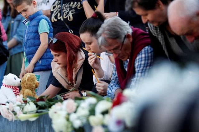 FILE PHOTO: People in Podgorica pay tribute following Belgrade school mass shooting