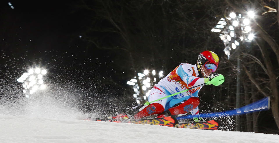 Austria's Marcel Hirscher skis past a gate in the second run of the men's slalom to win the gold medal at the Sochi 2014 Winter Olympics, Saturday, Feb. 22, 2014, in Krasnaya Polyana, Russia. (AP Photo/Alessandro Trovati)