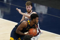 West Virginia's Derek Culver goes to the basket against Gonzaga's Drew Timme during the second half of an NCAA college basketball game Wednesday, Dec. 2, 2020, in Indianapolis. (AP Photo/Darron Cummings)