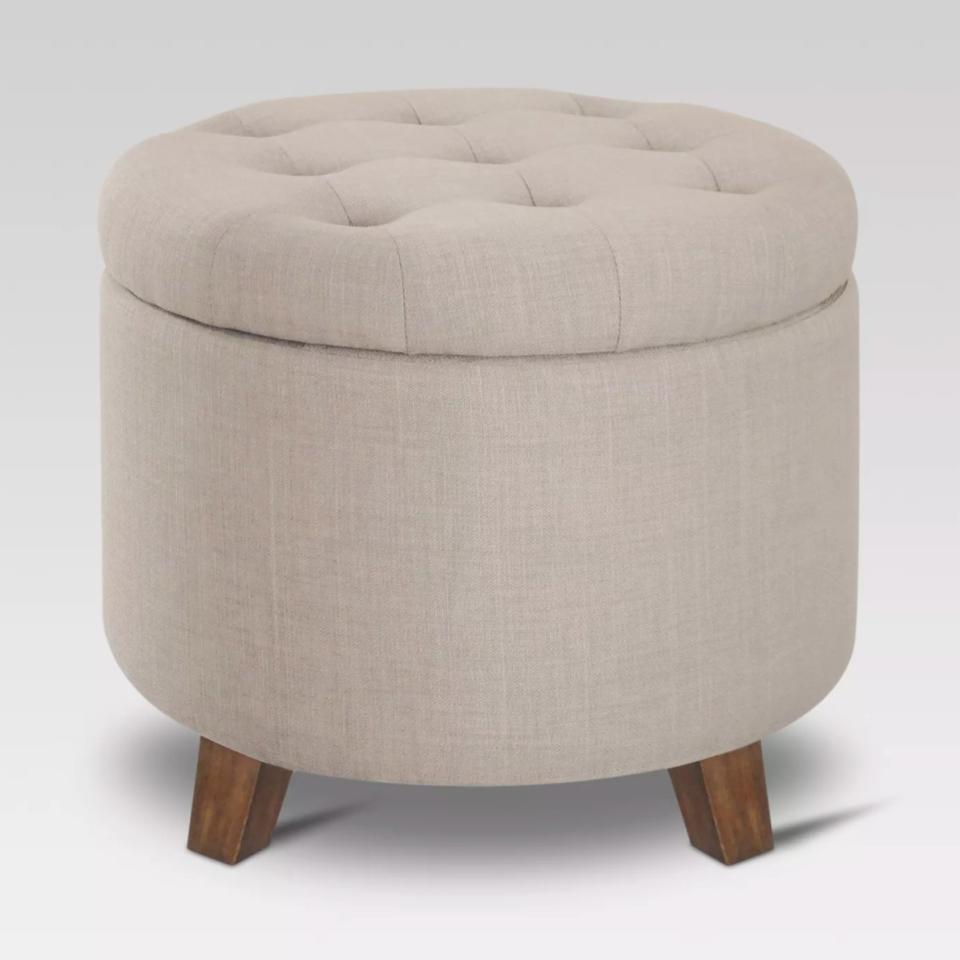 the round storage ottoman in cream