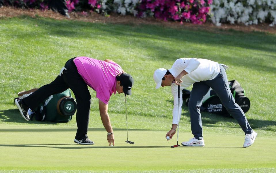 McIlroy and Reed at the 2018 Masters - Rory McIlroy: Yes I ignored Patrick Reed – because he subpoenaed me on Christmas Eve - GETTY IMAGES/DAVID CANNON