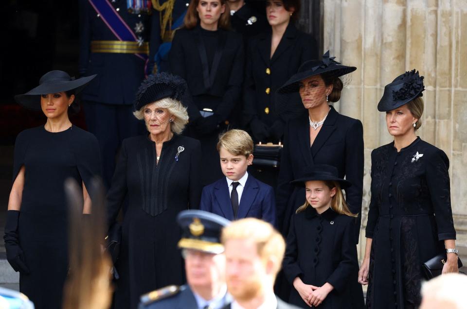 The royal family gathers outside of Westminster Abbey following the Queen's funeral.