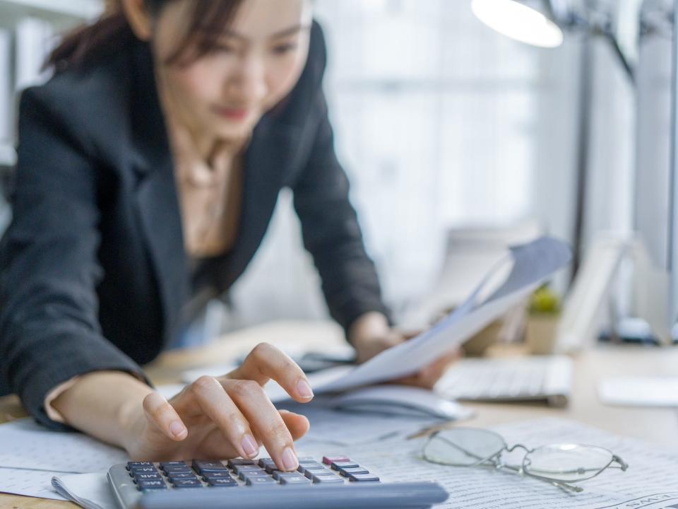 Worker using a calculator