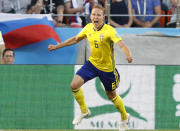 <p>Ludwig Augustinsson celebrates after giving Sweden a great chance to reach the knockout rounds </p>