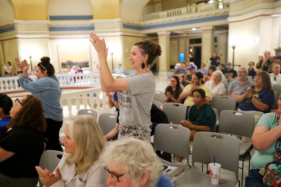 A crowd reacts to speakers during an Impeach Ryan Walters rally Saturday on the second floor of the State Capitol.