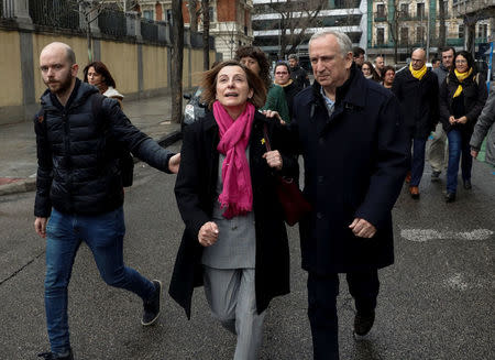 Catalan politician Carme Forcadell (C) walks back to the Supreme Court during a break in proceedings in Madrid as part of an investigation into Catalonia's banned bid for independence in Madrid, Spain, March 23, 2018. REUTERS/Juan Medina