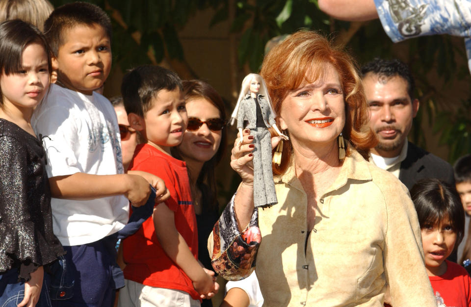 HOLLYWOOD - NOVEMBER 13:  Barbra Handler, daughter of Ruth Handler and namesake inspiration for the Barbie doll, shows a Barbie doll prior to placing her hands in cement that will adorn the sidewalk at the Egyptian Theatre on November 13, 2002 in Hollywood, California.  (Photo by Robert Mora/Getty Images)