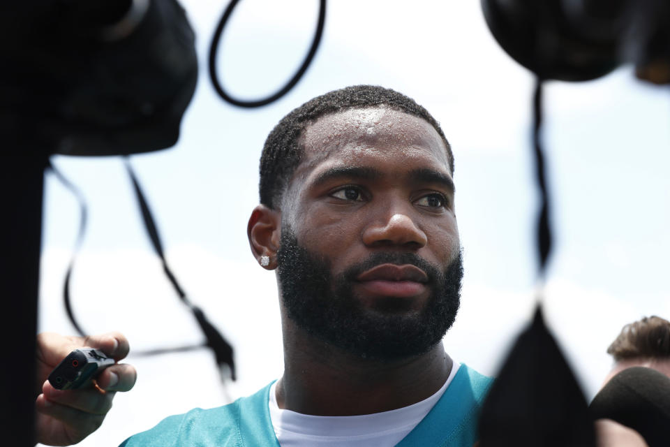 Miami Dolphins cornerback Xavien Howard (25) speaks to the media after NFL football practice on Tuesday, May 14, 2019, in Davie, Fla. (AP Photo/Brynn Anderson)