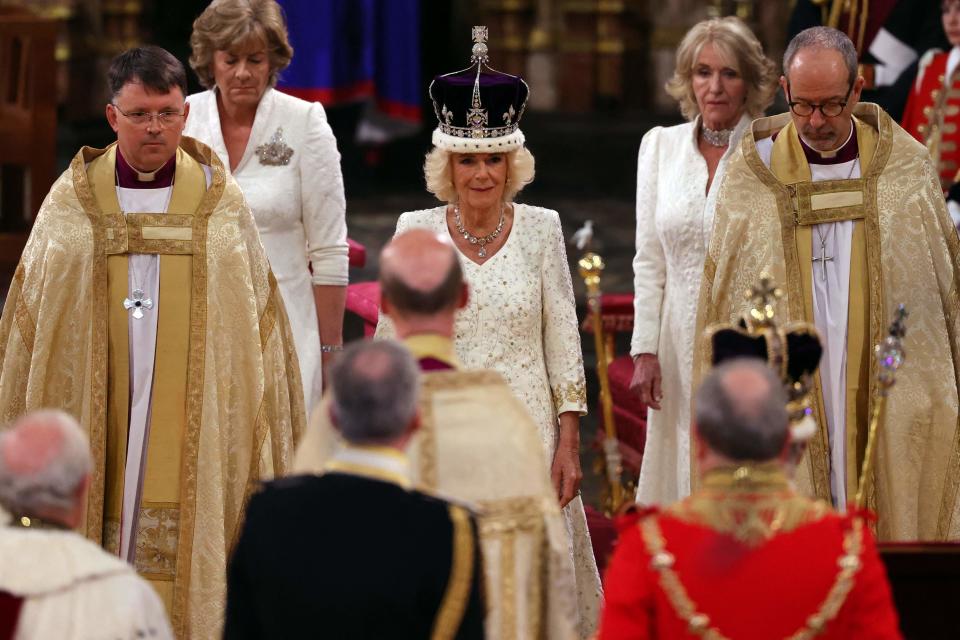 Britain's Camilla walks wearing a modified version of Queen Mary's Crown during the coronation ceremony.